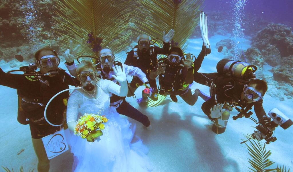 wedding under water with the full team